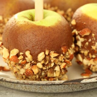 Four Healthy Caramel Apples on a plate.