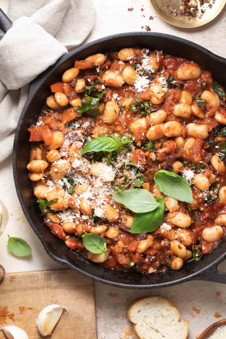 A cast iron skillet filled with Italian butter beans.