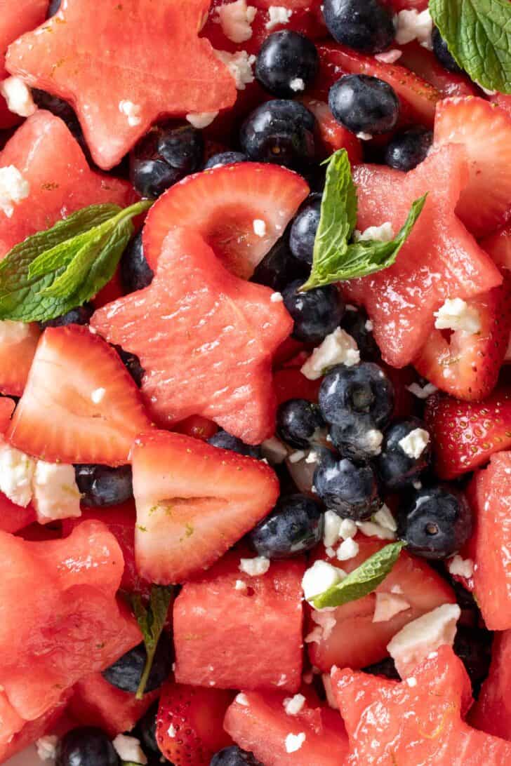 A white bowl filled with easy 4th of July Fruit Salad made with watermelon, strawberries and blueberries.