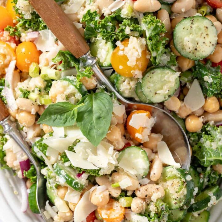 A white oval platter filled with White Bean Quinoa Salad.