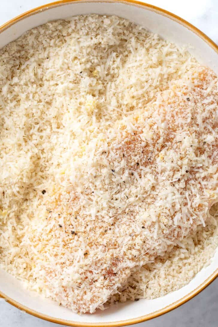 A white plate filled with panko bread crumbs