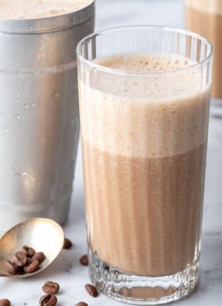 A clear drinking glass filled with Coffee Smoothie.